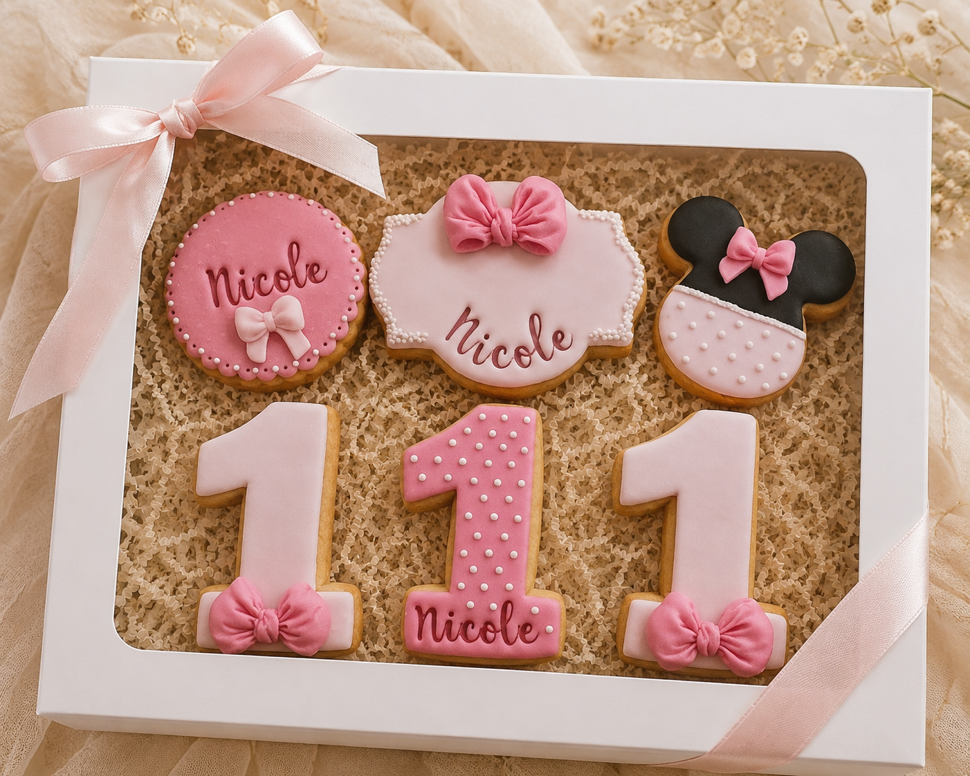 Biscotti primo compleanno rosa con fiocchi realizzati da Lucia Garro